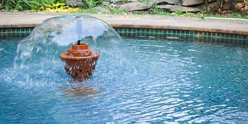 A swimming pool fountain