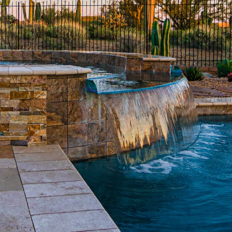 A beautiful spillover spa created by our Tucson pool and spa designers