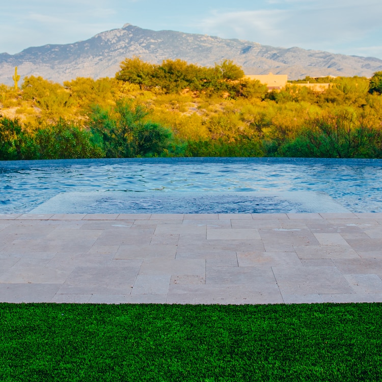 A minimalist pool design with a simple landscape