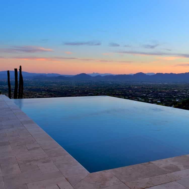 A pool with an infinity edge at sunset