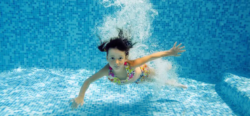 a girl swimming underwater