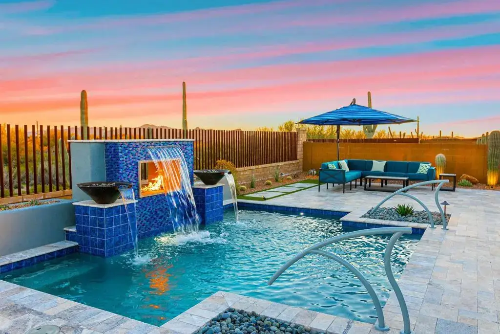 a resort style pool with water features from pools by design