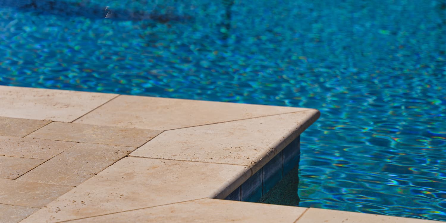 The edge of a pool, representing pool safety tips