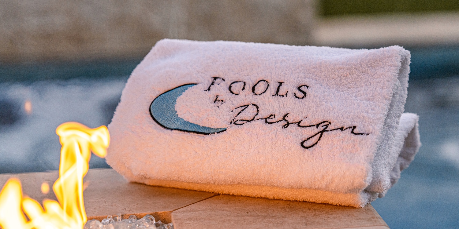A towel that we give clients after we build a pool for them