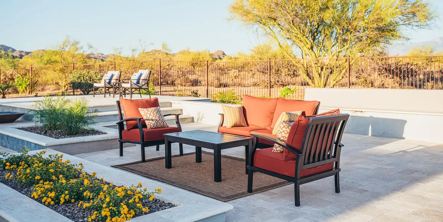 a personalized pool and backyard with colorful chairs