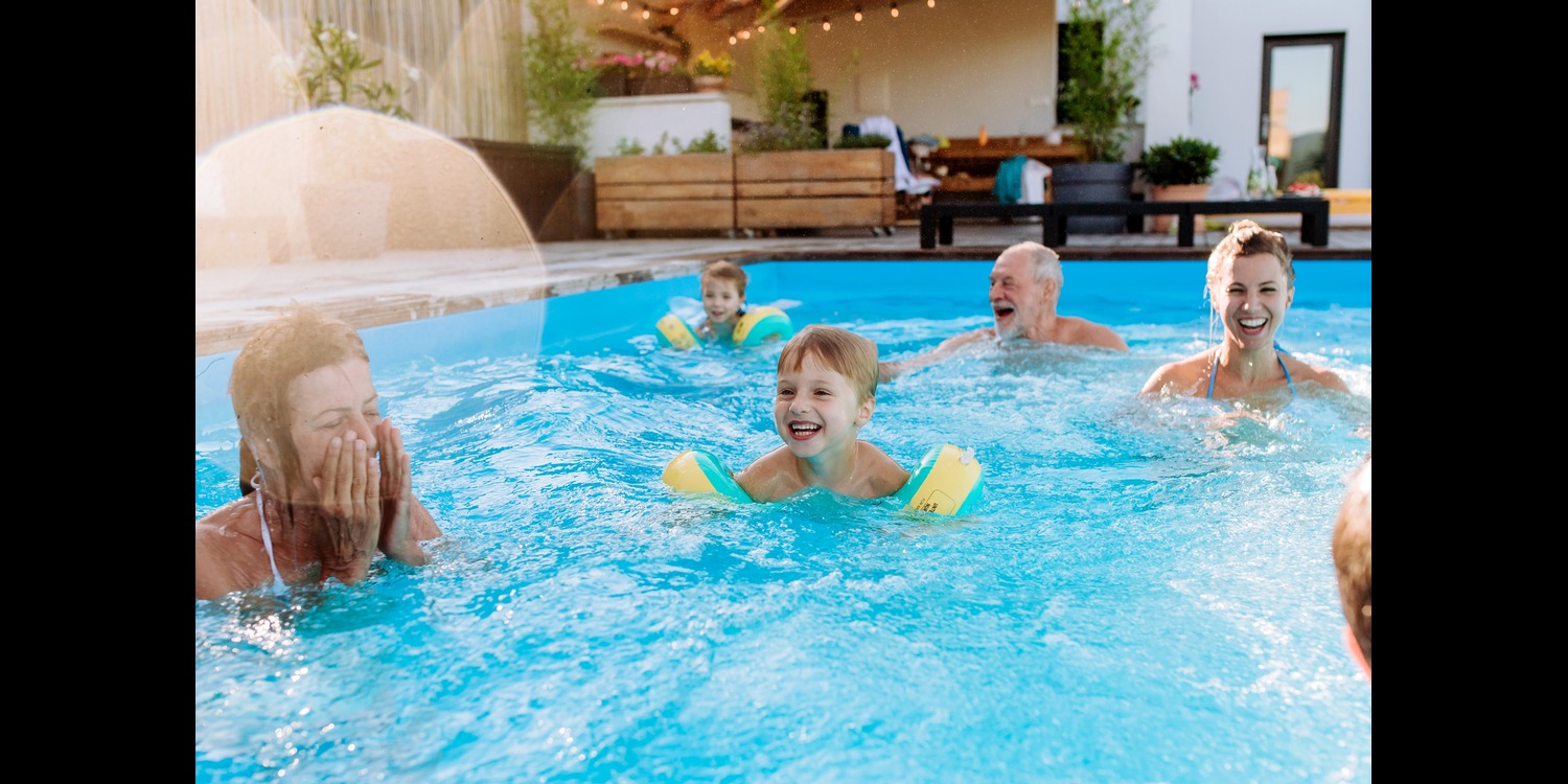 family enjoying in a pool designed by the pools by design