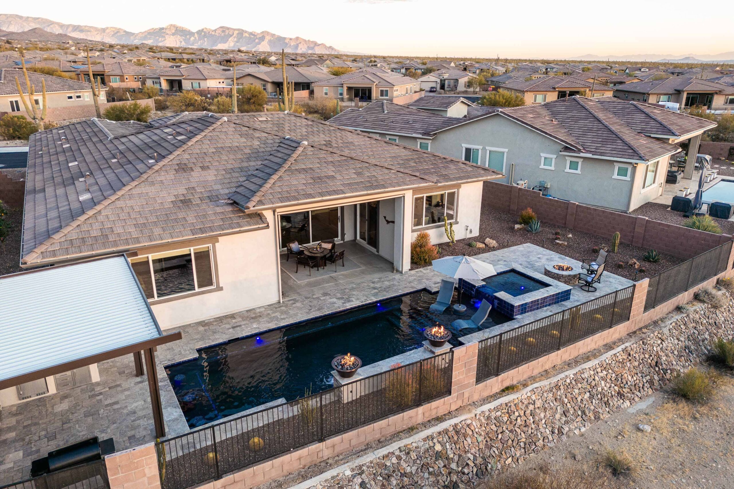 top view of houses with pool and spa near fire place built with pool design psychology